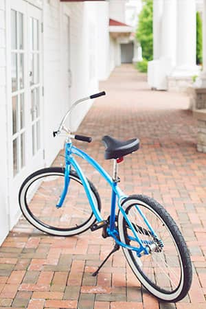Blue beach cruiser bicycle, brick pathway, Inn at Bay Harbor