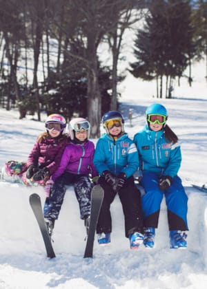 Young kids in skis smiling, Cottages at Bay Harbor