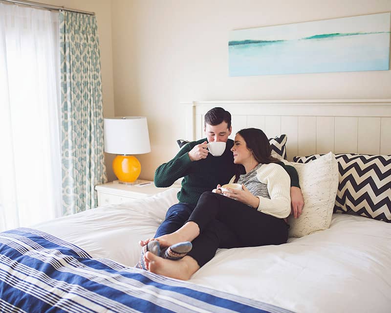 Couple enjoys morning snuggles in their Master Suite