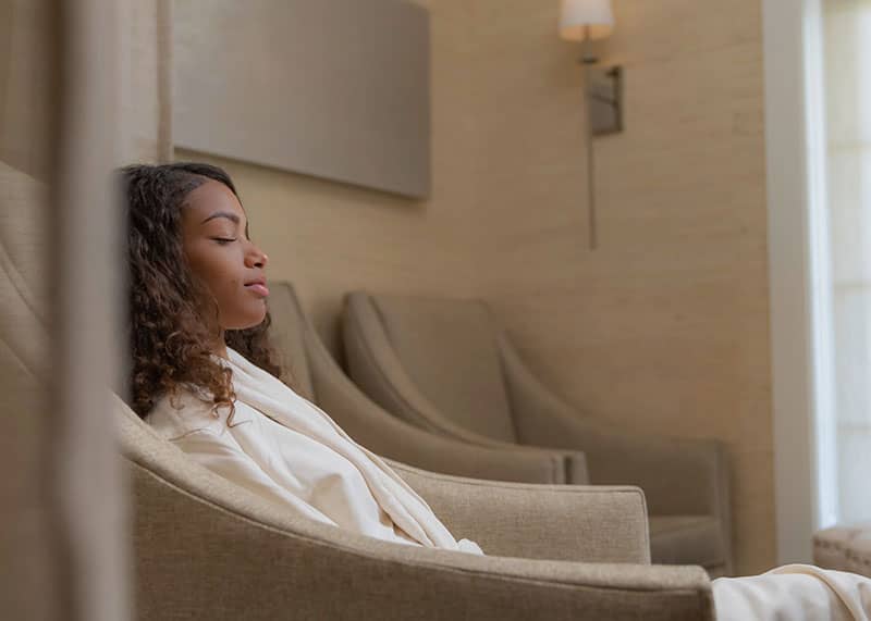Woman in The Spa's relaxation room
