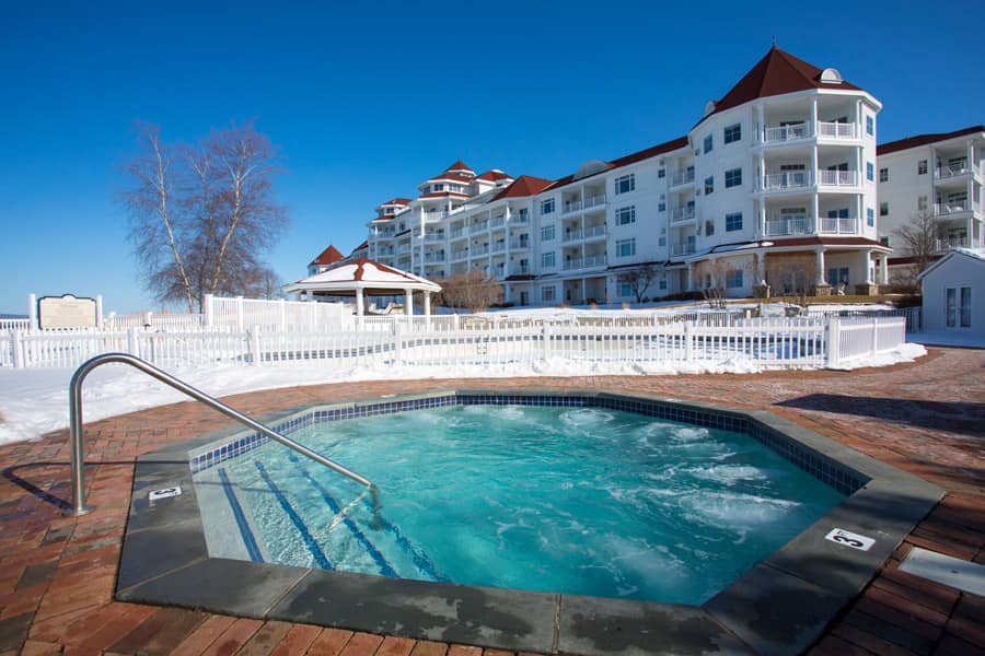 Snowy hot tub on sunny winter day, Inn at Bay Harbor
