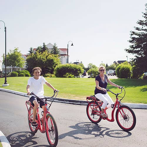 Mom, son ride e-bikes, Inn at Bay Harbor