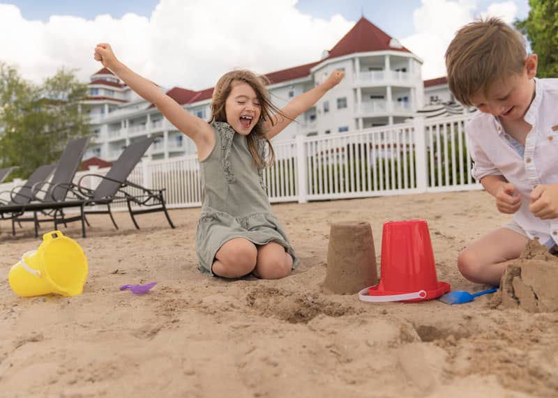 Sandcastle fun on beach, Inn at Bay Harbor