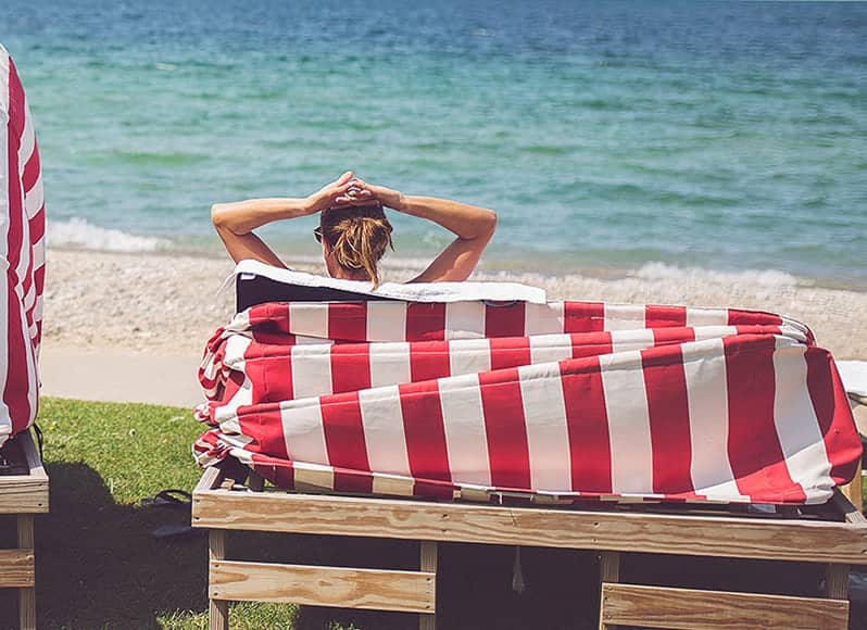 Red striped beach cabanas on Lake Michigan, Inn at Bay Harbor