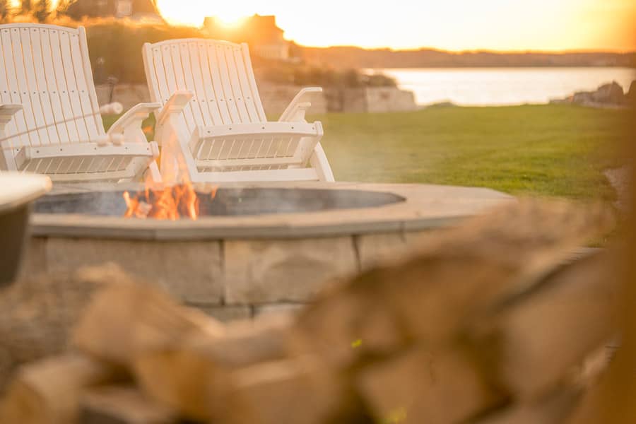 Sunset glow over lakeside firepit, Inn at Bay Harbor