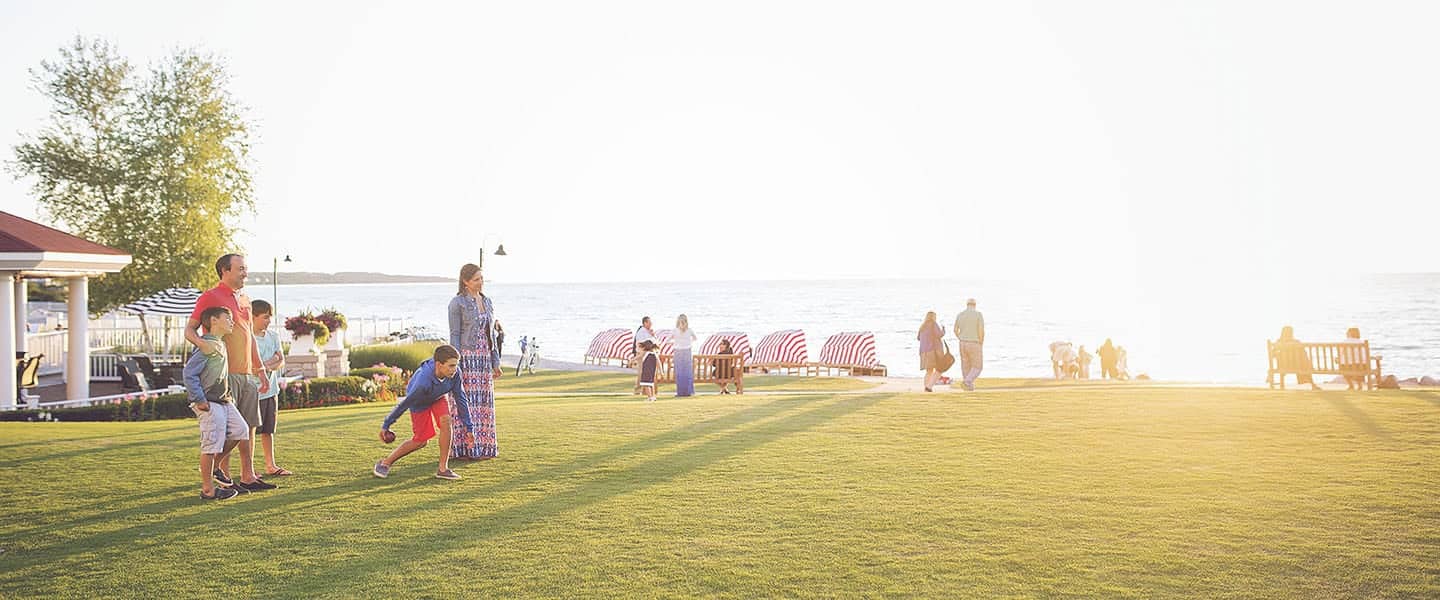 Family plays giant chess on Inn at Bay Harbor lakefront lawn