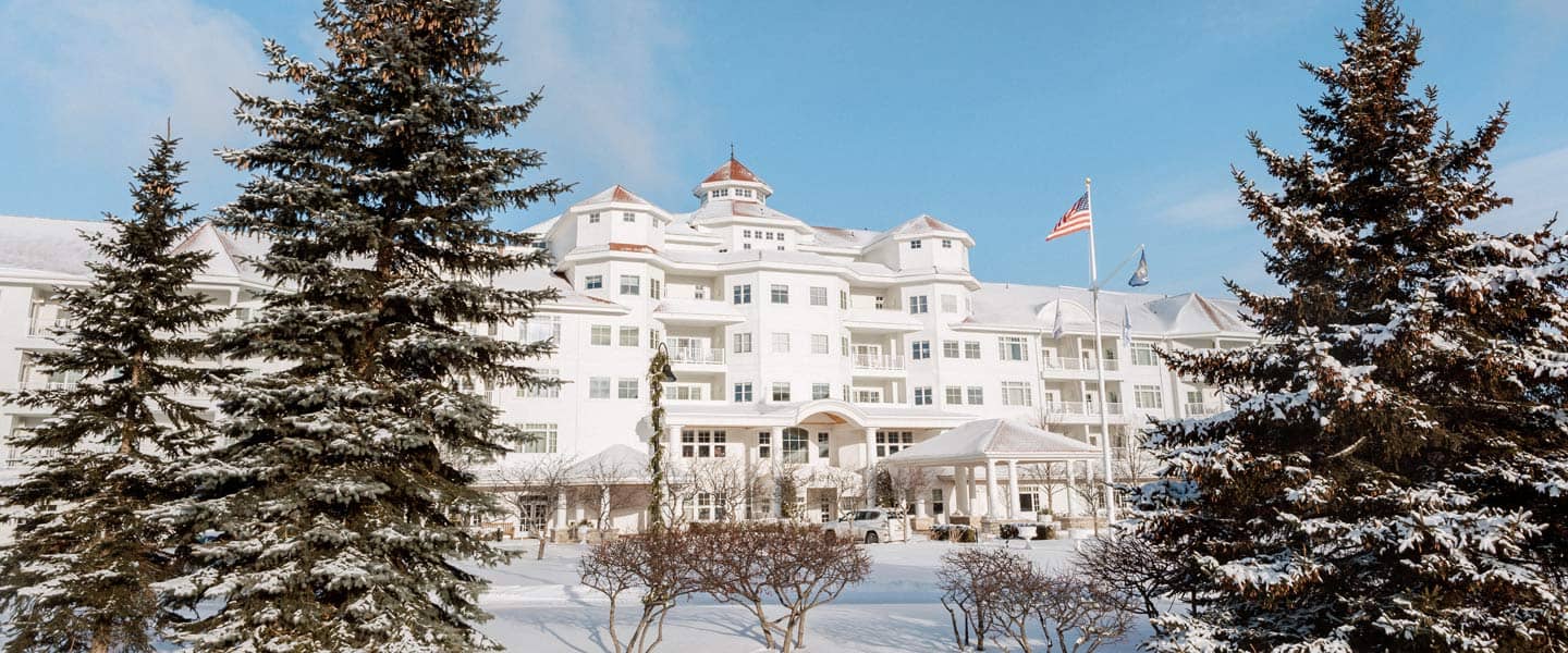 Inn at Bay Harbor winter front pine trees